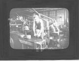 Pulling Out The sized bodies are given a crude shape by machines that flatten the crowns and brims.