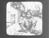 Eskimo Mother, Babe, and Pet Wolf on Steamer Deck, Greenland