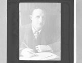 ZW. Sir E. Grey writing dispatches.