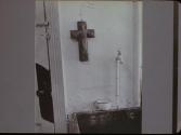 Crucifix over sink - St. Joseph's House