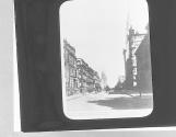 Horse-drawn buses drive past society's Fifth Avenue townhouses of 1894. Site of Rockefeller Center at left.