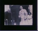 [Adolf Hitler entering building]