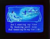 Am I wast-ing my time By think-ing you're mine ....