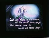 Look-ing from a dis-tance all the world seems gay--....