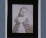 [Seated little girl, elbow projecting]