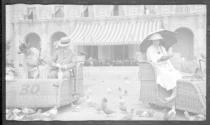 Eleanor Eastwood, George Eastman and Nell Newhall in Osborn Electriquettes feeding pigeons, California Trip