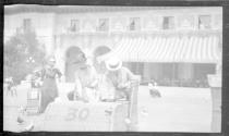 Eleanor Eastwood and George Eastman in Osborn Electriquette feeding pigeons, California Trip