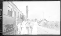 Party beside railroad car, California Trip