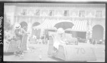 George Eastman and Nell Newhall in Osborn Electriquettes feeding pigeons at Expo, California Trip