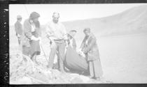 Group with boat by lake, Wyoming Trip