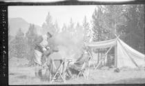 Eastwoods and Nell Newhall at table at campsite, Wyoming Trip