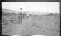 George Eastman and Mary Mulligan on horseback on trail, Arizona Trip