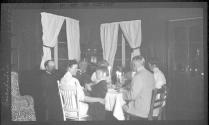 Interior, George Eastman and friends around table, Grand Cascapedia Trip