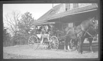 People in carriage in front of house, Oak Lodge Trip