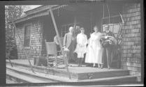George Eastman and friends on porch, Oak Lodge Trip