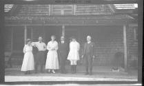 George Eastman and friends in front of houses, Oak Lodge Trip
