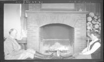 Eastwoods by fireplace, Oak Lodge Trip