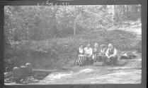 George Eastman and guests by wellheads & pumps, Oak Lodge Trip