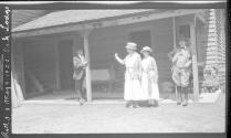 Guests on porch of house, Oak Lodge Trip