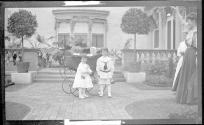 Dryden children posing in Eastman's garden with Watson Newhall