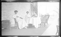 Nell Newhall and Ellen Dryden on Eastman's porch with children