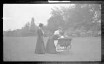 Ellen Dryden, Josephine Dickman and Nell Newhall in Eastman's garden with Watson Newhall