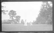 Woman in Eastman's garden with Dryden children
