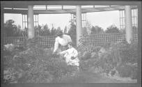 Woman in Eastman's garden with Dryden children
