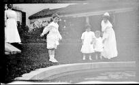Women in Eastman's garden with Dryden children and Watson Newhall