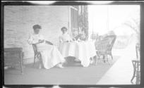 Nell Newhall and Ellen Dryden on porch with children