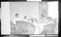 Nell Newhall on porch with children