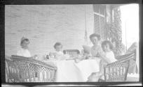 Nell Newhall on Eastman's porch with children