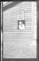 Women looking through an opening in wall, Oak Lodge Trip