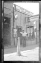 Man outside Mishler & Walker Photograph Supply Store, Arizona Trip