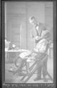 Dentist working inspecting African American girl at Eastman School, Oak Lodge Trip