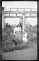 Woman in Eastman's garden with Dryden children