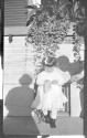 Girl on Eastman's porch