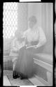 Woman in Conservatory with George Eastman Dryden