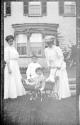 Women in Eastman's garden with Dryden children and Watson Newhall