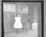 Boy & girl on porch, Oak Lodge Trip