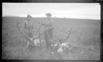 Hunting companions with dead caribou, Alaska trip