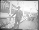 Dr. Audley Stewart on a ship's deck, Alaska trip