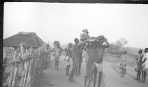 Osa Johnson carried by bearers, African Safari