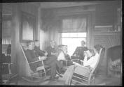 George Eastman and guests in living room, Oak Lodge Trip
