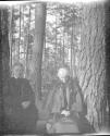 Adelaide Hubbell and Maria Eastman in forest, Oak Lodge Trip