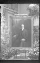 Philip Alexius de László's portrait of George Eastman displayed in conservatory