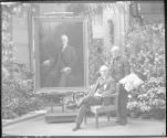 George Eastman and Philip Alexius de László in front of Eastman's portrait