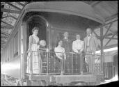 George Eastman with travel companions on train balconey, Mexican Trip