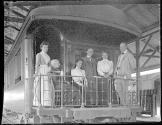 George Eastman and travel companions on train balcony, Mexico trip