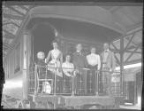 George Eastman and travel companions on train balcony, Mexican Trip